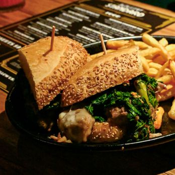 Industry Standard - Roast Pork Sandwich: Sliced roast pork, broccoli rabe, sun dried tomato garlic aioli, provolone, Noble hoagie roll, seasoned fries - New American Near Me - Phoenix, Arizona