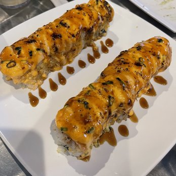 Trapper's Sushi - two pieces of sushi on a white plate - Sushi Bars Near Me - Lacey, Washington Trapper's Sushi - two pieces of sushi on a white plate - Sushi Bars Near Me - Lacey, Washington