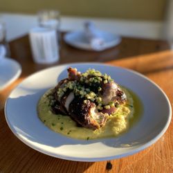 Brimmer & Heeltap - Enjoy our delicious Half Chicken, with creamy mascarpone polenta, caramelized red onion, and topped with a green apple and habanero zhug.