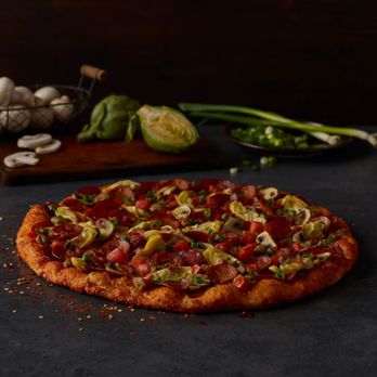 Round Table Pizza - a whole pizza with toppings - Pizza Near Me - Richland, Washington