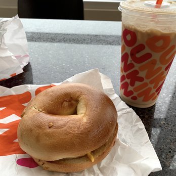 Dunkin' - Sausage, Egg, and Cheese on a toasted bagel with an Iced Latte - Coffee & Tea Near Me - Arlington, Virginia Dunkin' - Sausage, Egg, and Cheese on a toasted bagel with an Iced Latte - Coffee & Tea Near Me - Arlington, Virginia