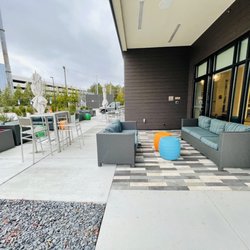 EVEN Hotel Atlanta - Cobb Galleria - Back patio and parking garage to the back