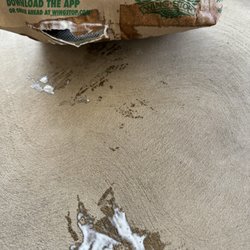 Wingstop - Broken bag with ranch spilling out.