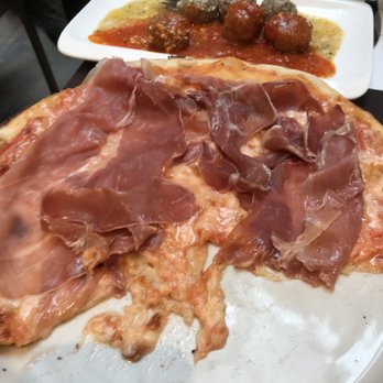 Emma Pizzeria - Sorry for the half eaten pizza, but it was delicious. Meatballs in the back - Pizza Near Me - Rome, RM