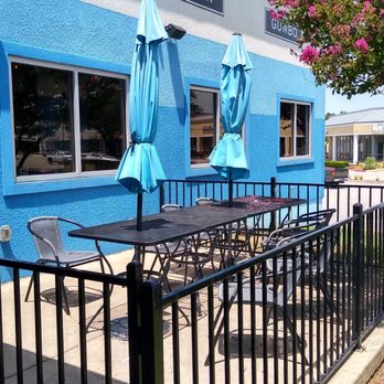 The Catch - Arlington  - A colorful paint that looks good next to the tree. - Seafood Near Me - Arlington, Texas