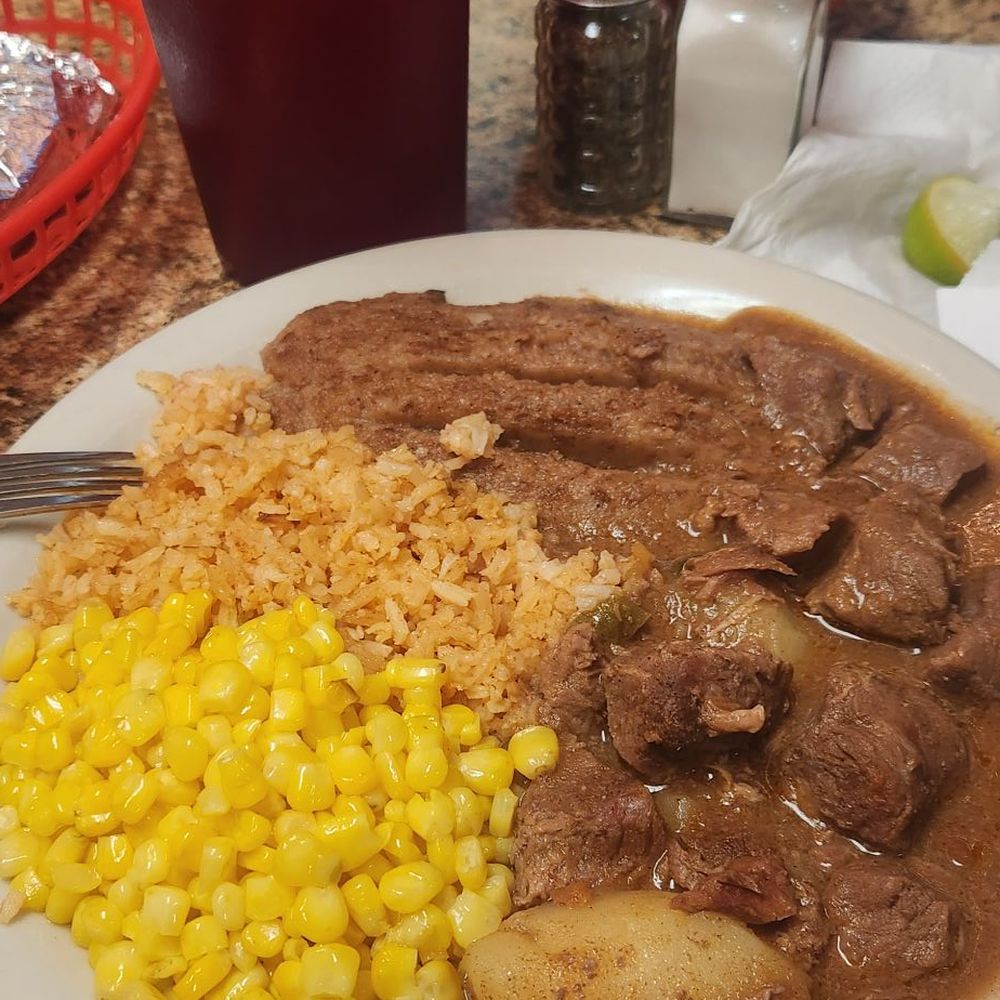 Carne guisada lunch plate with tea. Carne guisada lunch plate with tea.