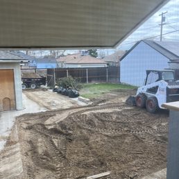 Cleaning up and leveling the dirt Cleaning up and leveling the dirt