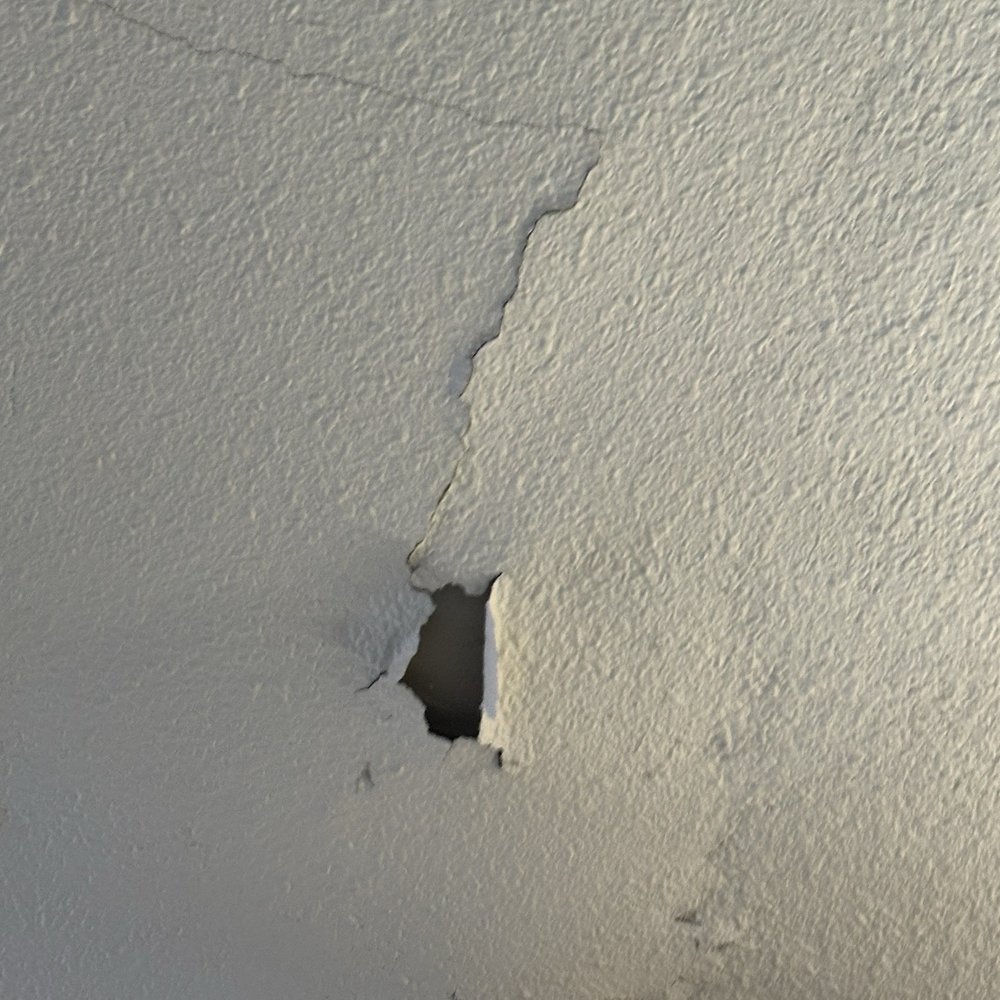 1A Garage Doors - The ceiling drywall after the A1 technician started picking at the drywall - Garage Door Services Near Me 1A Garage Doors - The ceiling drywall after the A1 technician started picking at the drywall - Garage Door Services Near Me