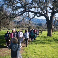 SYV Family School - Upper Campus hike, with grass mountain in the background.