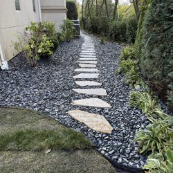 Renovatio Landscape & Design - Eden flag stone path and flat slate rock decorative stone landscape bed.