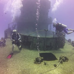 Planet Scuba - Rob on the left, helping explore a wreck in Cozumel