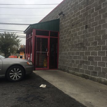 Crossroads Pizza - a car parked in front of a brick building - Pizza Near Me - Bridgeport, Connecticut