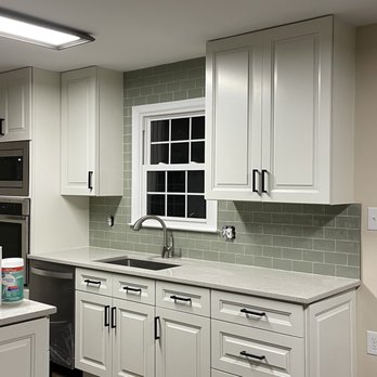 Carrillo Improvements - a clean kitchen with white cabinets - Painters Near Me