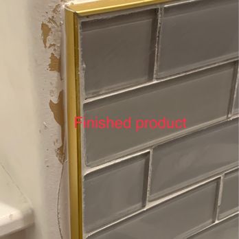 Distinct Tile Service - the finishing of a bathroom wall - Tiling Near Me
