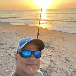 A1A Beach Rentals - Happy me, riding my bicycle on the beach to go fishing