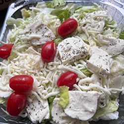 East Coast Enzo’s Pizza - A Caprese salad doesn't include shredded and sliced mozzarella.