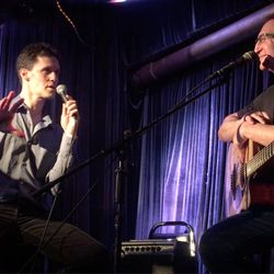 Dan Smith Will Teach You Guitar - David Acker giving his post performance interview with Dan Smith on stage at The West End Lounge.