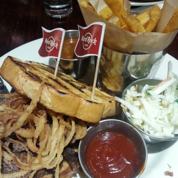 Hard Rock Cafe - Beef brisket sandwich with fries, slaw, and cowboy beans. - American Near Me - Myrtle Beach, South Carolina Hard Rock Cafe - Beef brisket sandwich with fries, slaw, and cowboy beans. - American Near Me - Myrtle Beach, South Carolina