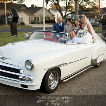 Welch Photography & Video - Bride arriving in old car for wedding at The Ridgeway in Metairie, LA - Videographers Near Me - Covington, Louisiana Welch Photography & Video - Bride arriving in old car for wedding at The Ridgeway in Metairie, LA - Videographers Near Me - Covington, Louisiana