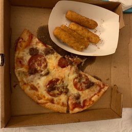 a slice of pizza with a side of breadsticks a slice of pizza with a side of breadsticks