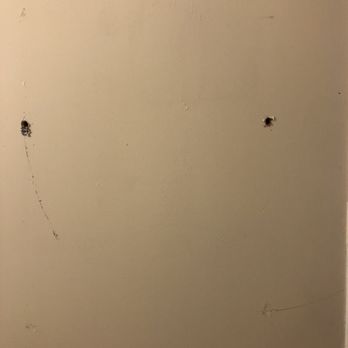 Silver Beach Hotel - Holes in the wall from a missing towel bar. - Hotels Near Me - St. Joseph, Michigan