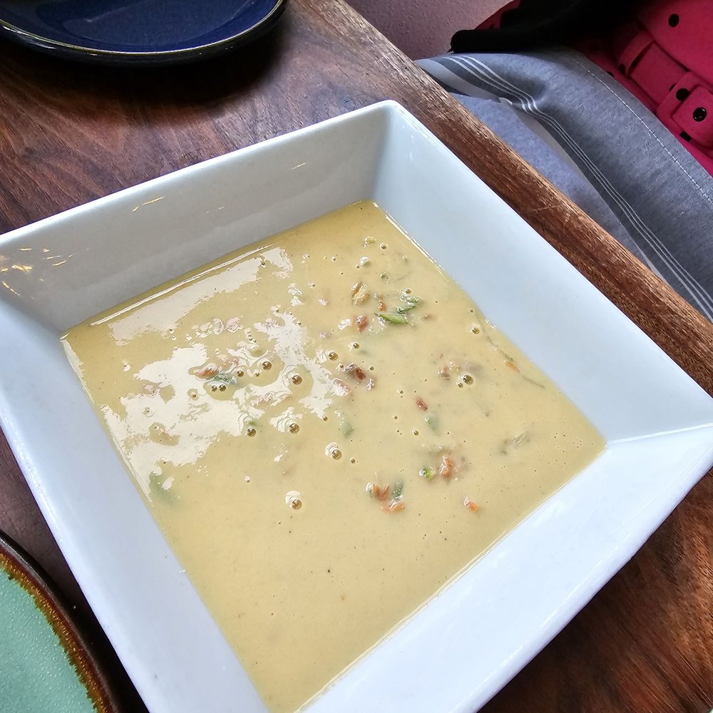 Brix 25 - Salmon soup, poured table-side - New American Near Me - Gig Harbor, Washington