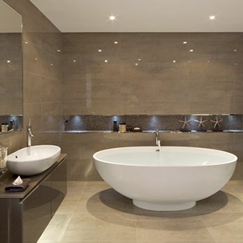 Precision Construction and Remodel - 12" x 24" porcelain tile with a modern looking free standing bath tub. - General Contractors Near Me Precision Construction and Remodel - 12" x 24" porcelain tile with a modern looking free standing bath tub. - General Contractors Near Me