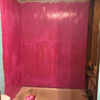 Epperson Construction - a bathtub with pink paint - General Contractors Near Me