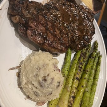 Carrabba's Italian Grill - Tuscan-Grilled Ribeye* 16 oz. Garlic Mashed Potatoes Grilled Asparagus - Italian Near Me - Southport, Indiana Carrabba's Italian Grill - Tuscan-Grilled Ribeye* 16 oz. Garlic Mashed Potatoes Grilled Asparagus - Italian Near Me - Southport, Indiana