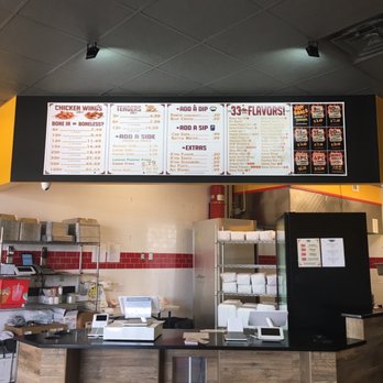Wings World - menus on the wall above the counter - Chicken Wings Near Me - Cedar Hill, Texas