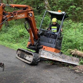 Rain City Tree Works - picking up log after cutting down tree. - Tree Services Near Me - Snoqualmie, Washington Rain City Tree Works - picking up log after cutting down tree. - Tree Services Near Me - Snoqualmie, Washington