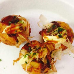 Rixie's Carry Out - Delicious Japanese Fried Tako Balls topped with Japanese mayonaise/Tako sauce and shaved dried fish.