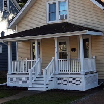 Goldenboy Contracting - a yellow house with a white porch - General Contractors Near Me Goldenboy Contracting - a yellow house with a white porch - General Contractors Near Me
