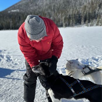 Snowy Owl Sled Dog Tours - Us with our dog team at the halfway mark (on the frozen lake) - Tours Near Me - Canmore, Alberta Snowy Owl Sled Dog Tours - Us with our dog team at the halfway mark (on the frozen lake) - Tours Near Me - Canmore, Alberta
