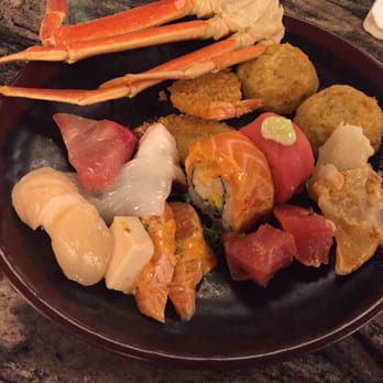 Mizuki Buffet - Snow crab legs, an assortment of sashimi and sushi with a side of crab cakes. - Buffets Near Me - Tukwila, Washington