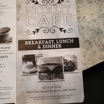 Nicollet Cafe - Menu - A black-and-white printed flyer for Nicollet Cafe in Saint Peter, MN, displaying the cafe's name at the top with decorative flourishes. It advertises breakfast, lunch, and dinner, and includes three black-and-white photos of food items. The flyer provides a phone number and address: 402 S 3rd Street, Saint Peter, MN 56082. Additional text mentions that items can be prepared for carryout with a small extra charge and includes a disclaimer about responsibility for lost or stolen personal property. - Breakfast & Brunch Near Me - Saint Peter, Minnesota