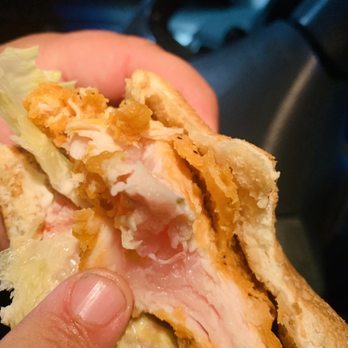 Wendy's - a hand holding a half eaten sandwich - Fast Food Near Me - Sacramento, California