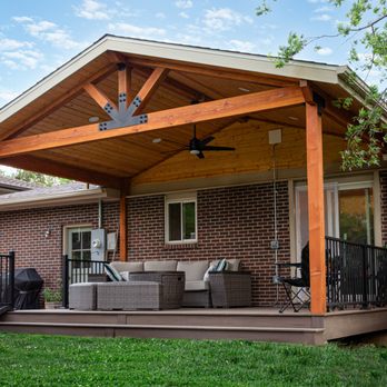 O'Keefe Built - Boulder Colorado Patio Cover with Black Hardware and Deckorators Voyage Decking, with a Stamped Concrete Pad - Decks & Railing Near Me - Longmont, Colorado