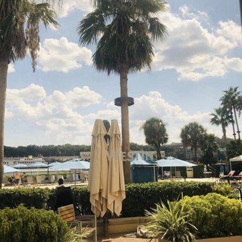 Midnight Sun Lounge - a view of a pool and palm trees - Lounges Near Me - Savannah, Georgia