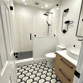 Murillo Tile Stone - a bathroom with a shower, toilet, and sink - Tiling Near Me Murillo Tile Stone - a bathroom with a shower, toilet, and sink - Tiling Near Me
