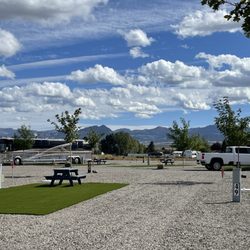 Henrie's Hitch N Post RV Resort - Henries Hitch N Post RV resort economy gravel pull through site. All of our sites are full hook up