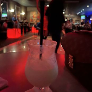 Touche - a drink in a glass on a bar - Dance Clubs Near Me - Overland Park, Kansas