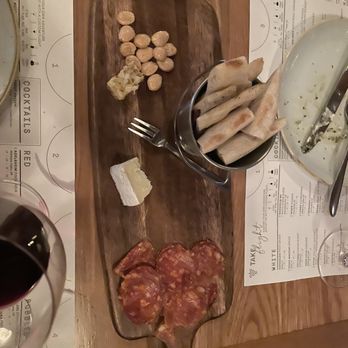 Sixty Vines - Charcuterie, we got the spicy salametto pic ate and the cowgirl creamy cheese. It came paired with fresh honey comb, nuts, and bread - New American Near Me - Charlotte, North Carolina