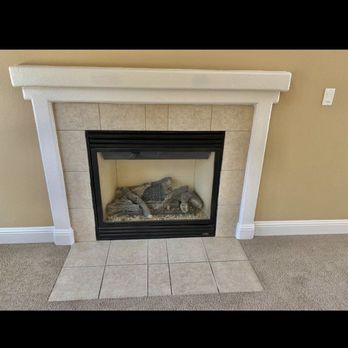 The Handy Hipsters - Before tile around fireplace. Note* same tile was at front door - Handyman Near Me The Handy Hipsters - Before tile around fireplace. Note* same tile was at front door - Handyman Near Me