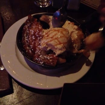 Jake Melnick's Corner Tap - Warm Apple Pie Skillet- Fresh baked old-fashioned apple pie served with vanilla ice cream - Sports Bars Near Me - Chicago, Illinois Jake Melnick's Corner Tap - Warm Apple Pie Skillet- Fresh baked old-fashioned apple pie served with vanilla ice cream - Sports Bars Near Me - Chicago, Illinois