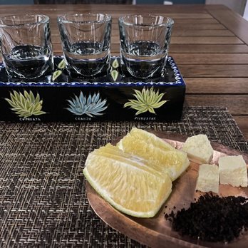 Lu Cocina Michoacana - Mezcal Flight served with black salt, orange and cheese. - Mexican Near Me - Morelia, MIC Lu Cocina Michoacana - Mezcal Flight served with black salt, orange and cheese. - Mexican Near Me - Morelia, MIC