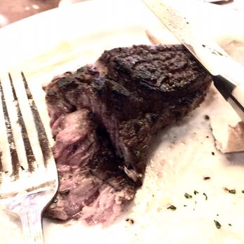 Ocean Prime - Bad lighting poor photo, but this is a super charred over done steak with very very rare middle. It was unseasoned and inedible. - Seafood Near Me - Denver, Colorado
