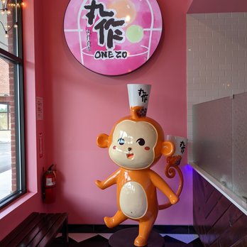One Zo Boba - Duluth - Inside. Cute monkey statue with boba tea at the entryway. - Bubble Tea Near Me - Duluth, Georgia