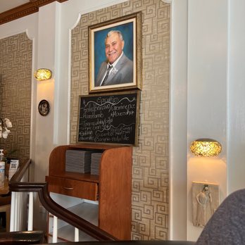 Athena Cafe - a portrait of a man in a suit and tie - Greek Near Me - Avon Park, Florida Athena Cafe - a portrait of a man in a suit and tie - Greek Near Me - Avon Park, Florida