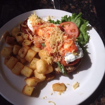 Symposium Cafe Restaurant Markham - eggs benedict (tuscan style so it seems there wasnt much hollandaise sauce, if at all, but  instead a fresh tomato sauce) - Breakfast & Brunch Near Me - Markham, Ontario